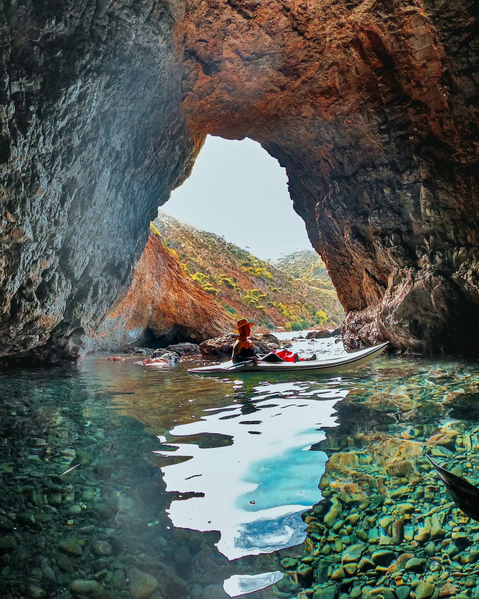 Kayaker exploring a cove